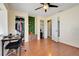 Versatile bedroom with hardwood floors, a built-in closet, and a workstation at 106 8Th St, Lake Hamilton, FL 33851