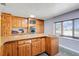 Kitchen featuring ample cabinets, granite countertops, built-in appliances, and a kitchen island at 106 8Th St, Lake Hamilton, FL 33851
