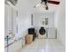 Functional laundry room with modern washer and dryer units and plenty of space at 106 8Th St, Lake Hamilton, FL 33851