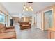 Inviting living room featuring neutral tones, tile flooring, and an open layout perfect for entertaining at 106 8Th St, Lake Hamilton, FL 33851