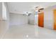 Bright living room featuring tile floors, wainscotting, and neutral paint at 106 8Th St, Lake Hamilton, FL 33851
