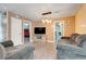 Comfortable living room with a TV, couches, and a view of the doorway to the bedroom at 106 8Th St, Lake Hamilton, FL 33851