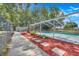 Enclosed pool area with brick trim and lush plants at 106 8Th St, Lake Hamilton, FL 33851