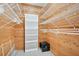 This large walk-in closet is equipped with shelving and a safe at 106 8Th St, Lake Hamilton, FL 33851