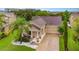 Lovely home featuring beautiful landscaping, a two-car garage, and a charming front porch at 1089 Seburn Rd, Apopka, FL 32703
