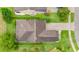 Birds eye view of the house, showing the roof, driveway, and surrounding greenery at 1089 Seburn Rd, Apopka, FL 32703