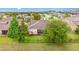 Aerial shot of a fenced backyard with established trees at 1089 Seburn Rd, Apopka, FL 32703