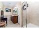 Well-lit bathroom featuring a double vanity sink, soaking tub, and tiled walk-in shower at 1089 Seburn Rd, Apopka, FL 32703