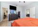 Spacious bedroom with TV, ensuite bath, and walk-in closet access at 1089 Seburn Rd, Apopka, FL 32703
