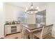 Elegant dining room area featuring natural lighting and modern chandelier at 1089 Seburn Rd, Apopka, FL 32703