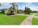 Well-maintained single-Gathering home featuring a lush green lawn and mature landscaping at 1089 Seburn Rd, Apopka, FL 32703