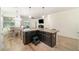 Open kitchen and eat-in area with granite countertop, hardwood floors, and stainless steel appliances at 1089 Seburn Rd, Apopka, FL 32703