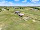 Aerial view of a property with a home, barn, pool and fence at 11115 Romance Ct, Winter Garden, FL 34787