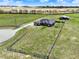 Aerial view of luxury home on estate lot with barn, pool, and fenced acreage at 11115 Romance Ct, Winter Garden, FL 34787