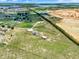 Scenic aerial view of estate with home, pool, barn, long driveway and fenced pasture at 11115 Romance Ct, Winter Garden, FL 34787