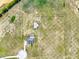 Overhead shot of a rural property featuring a home with a pool, a barn, and expansive grassy land at 11115 Romance Ct, Winter Garden, FL 34787