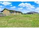 View of a barn with green siding, doors with crosses, pasture and screen enclosed pool at 11115 Romance Ct, Winter Garden, FL 34787