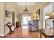 Bright living room with hardwood floors, high ceilings, and an adjacent bedroom space at 11115 Romance Ct, Winter Garden, FL 34787