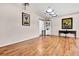 Open living space featuring hardwood floors, a desk, and decorative artwork at 11115 Romance Ct, Winter Garden, FL 34787