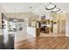Spacious area showcases hardwood floors, an open kitchen, and outdoor access at 11115 Romance Ct, Winter Garden, FL 34787