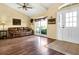 Bright living area with hard wood flooring, comfortable leather sofa, and ample natural light at 11115 Romance Ct, Winter Garden, FL 34787