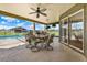 Covered patio with ceiling fan, table and chairs that offers a relaxing outdoor dining space at 11115 Romance Ct, Winter Garden, FL 34787