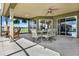 Covered patio with ceiling fan and outdoor seating, perfect for enjoying the view at 11115 Romance Ct, Winter Garden, FL 34787
