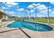Inviting in-ground pool with a screened enclosure, offering privacy and relaxation in a serene backyard setting at 11115 Romance Ct, Winter Garden, FL 34787