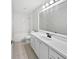 Bright bathroom featuring white cabinets, a shower and tub combination, and tiled floors at 120 Marion Oaks Mnr, Ocala, FL 34473