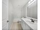 Bright bathroom featuring white cabinets, a shower and tub combination, and tiled floors at 120 Marion Oaks Mnr, Ocala, FL 34473