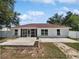 The house features a screened in patio and large concrete tile patio area at 120 Marion Oaks Mnr, Ocala, FL 34473