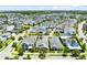 Aerial view of a residential community with tree-lined streets, manicured lawns, and diverse home styles at 13701 Chauvin Ave, Orlando, FL 32827