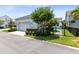 Charming single-story home with manicured landscaping, fenced yard, and attached garage at 13701 Chauvin Ave, Orlando, FL 32827