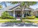 Charming single-story home with a well-maintained yard, landscaping, and inviting porch at 13701 Chauvin Ave, Orlando, FL 32827