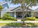Charming single-story home with a well-maintained yard, landscaping, and inviting porch at 13701 Chauvin Ave, Orlando, FL 32827