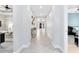 Long hallway with tile flooring and views of multiple rooms, creating an open and airy feel at 13701 Chauvin Ave, Orlando, FL 32827