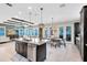 Open-concept kitchen and dining area with a large island and modern appliances at 13701 Chauvin Ave, Orlando, FL 32827