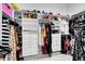 Well-organized walk-in closet with ample shelving, hanging space, and drawers for clothing and accessories at 13701 Chauvin Ave, Orlando, FL 32827