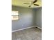 Bedroom with neutral-colored walls, tile flooring, and a ceiling fan at 14330 Ellerbee St, Winter Garden, FL 34787