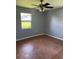 Bedroom featuring wood parquet flooring, neutral walls, and natural light at 14330 Ellerbee St, Winter Garden, FL 34787