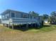 Charming home with light blue wood and a raised porch overlooking the yard at 14330 Ellerbee St, Winter Garden, FL 34787