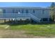 Charming home exterior with raised porch and light blue painted wood at 14330 Ellerbee St, Winter Garden, FL 34787