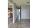 Hallway view with tile floors connecting kitchen and other rooms at 14330 Ellerbee St, Winter Garden, FL 34787
