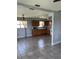 Open kitchen and dining area with tile floors and warm wood cabinets at 14330 Ellerbee St, Winter Garden, FL 34787