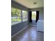 Bright laundry room with large windows offering natural light and a view of the outdoors at 14330 Ellerbee St, Winter Garden, FL 34787