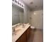 Bright bathroom featuring a shower-tub combo and a double sink vanity with ample counter space at 14531 Pleach St, Winter Garden, FL 34787