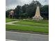 Scenic community landmark featuring manicured landscaping and patriotic decor at 14531 Pleach St, Winter Garden, FL 34787
