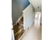 Inviting entryway showcasing a staircase and neutral tile flooring leading to the living area at 14531 Pleach St, Winter Garden, FL 34787