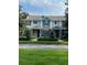 Charming townhome featuring a well-maintained front yard and a welcoming entrance at 14531 Pleach St, Winter Garden, FL 34787