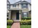 Inviting townhouse featuring a covered entrance and brick walkway at 14531 Pleach St, Winter Garden, FL 34787